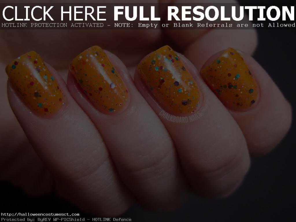 Glittery orange nail art designs